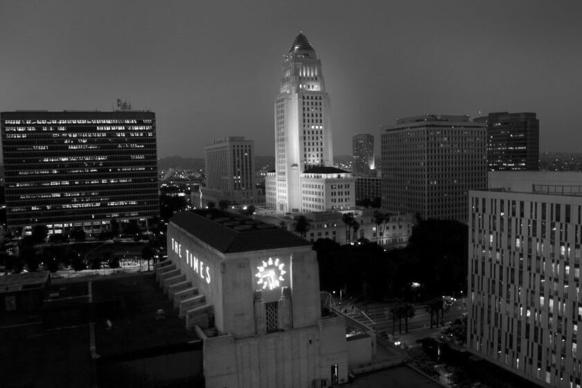 The historic Los Angeles Times building with Los Angeles city Hall in the background.