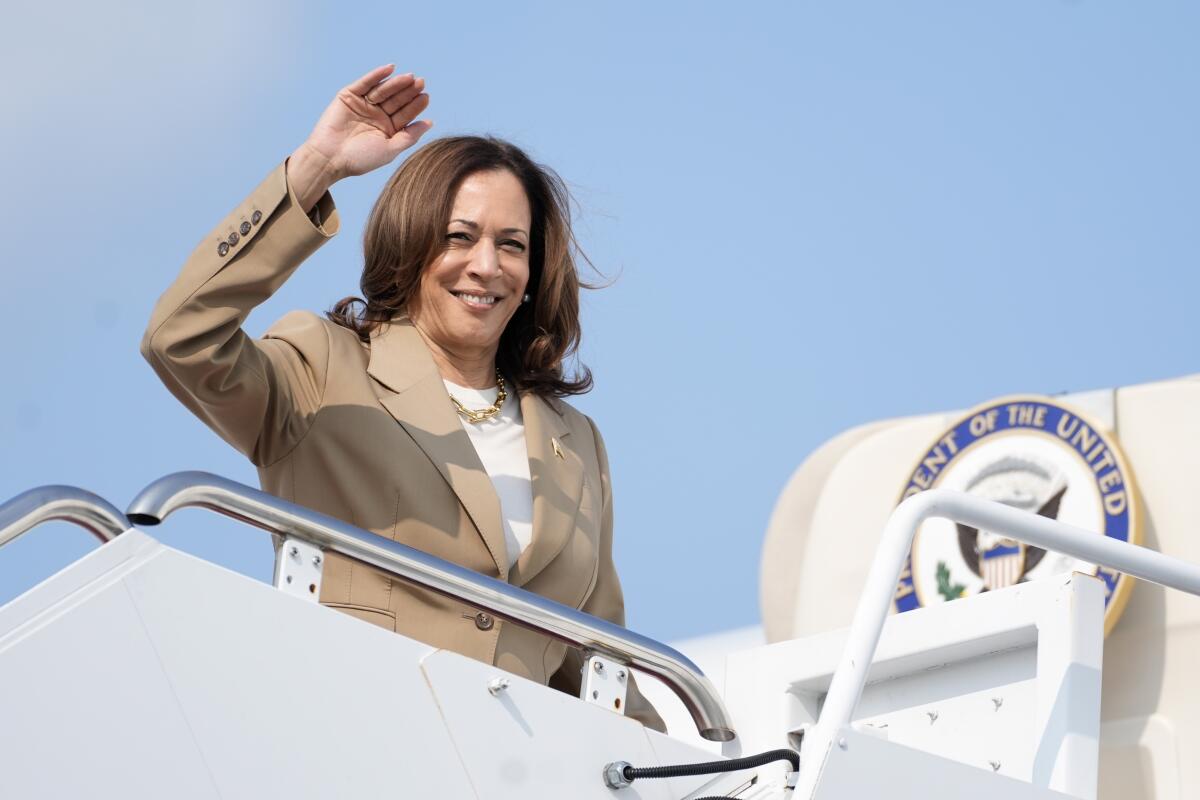 Vice President Kamala Harris waves while boarding Air Force Two in Westfield, Mass., on July 27. 