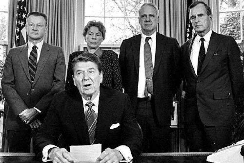 Jeane Kirkpatrick is among conservative leaders meeting President Reagan meets in the Oval Office in 1985.