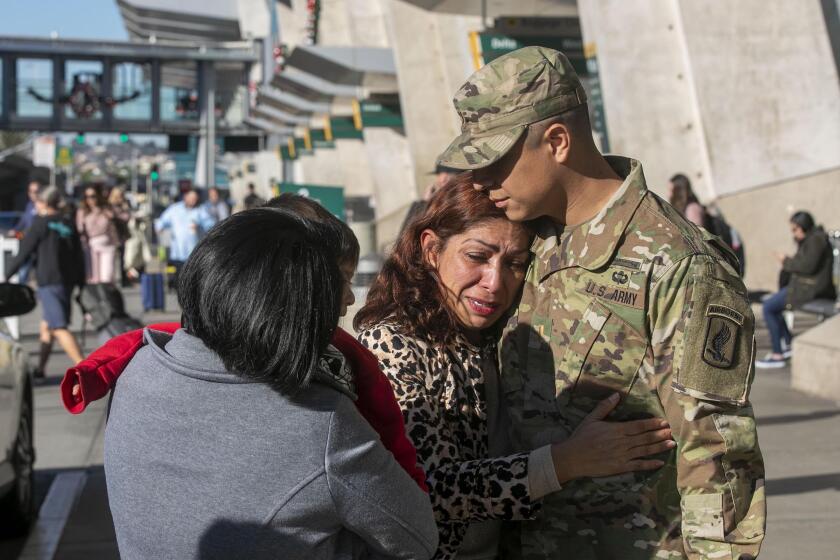 Rocio Rebollar Gomez hugs her thirty year-0old son 2nd Lt. Gibram Cruz after he arrived fat San Diego Intl. Airport on Thursday, December 18, 2019. Rocio is facing a January 2, 2020 date to report to the border to comply with a deportation order. This could be the last time he sees her in the United States unless a legislative or administrative miracle comes through.