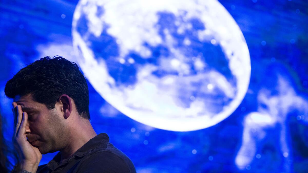 An Israeli man reacts in Tel Aviv after the Beresheet spacecraft fails to land safely on the moon on April 11.