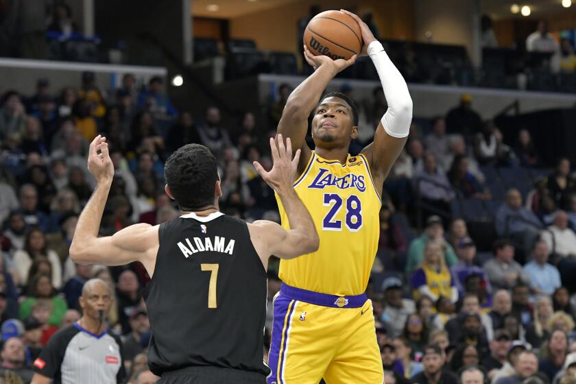 Lakers forward Rui Hachimura shoots against Memphis forward Santi Aldama in the first half.