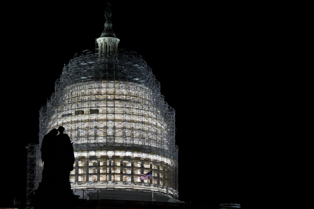 The statue atop the Ulysses S. Grant Memorial on the Capitol Hill is silhouetted by the Capitol dome in Washington. The year ahead is likely to be filled with 2016 presidential politics.