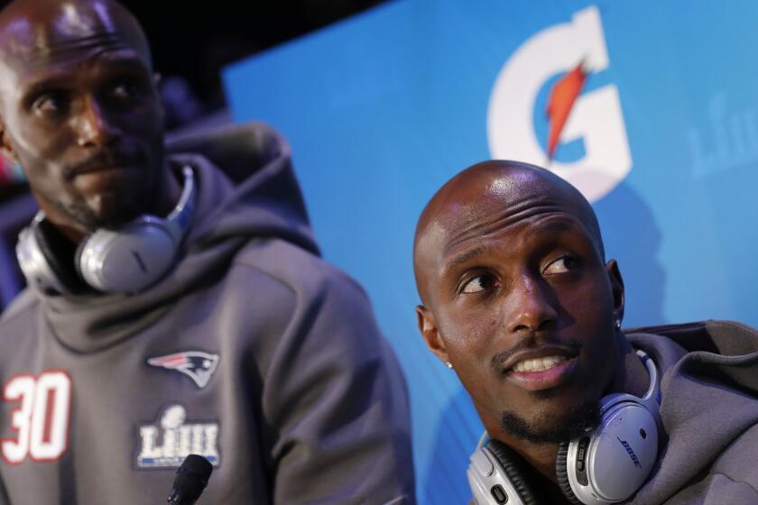 New England Patriots' Jason McCourty and Devin McCourty answer questions during Opening Night for the NFL Super Bowl 53 football game Monday, Jan. 28, 2019, in Atlanta. (AP Photo/David Goldman)