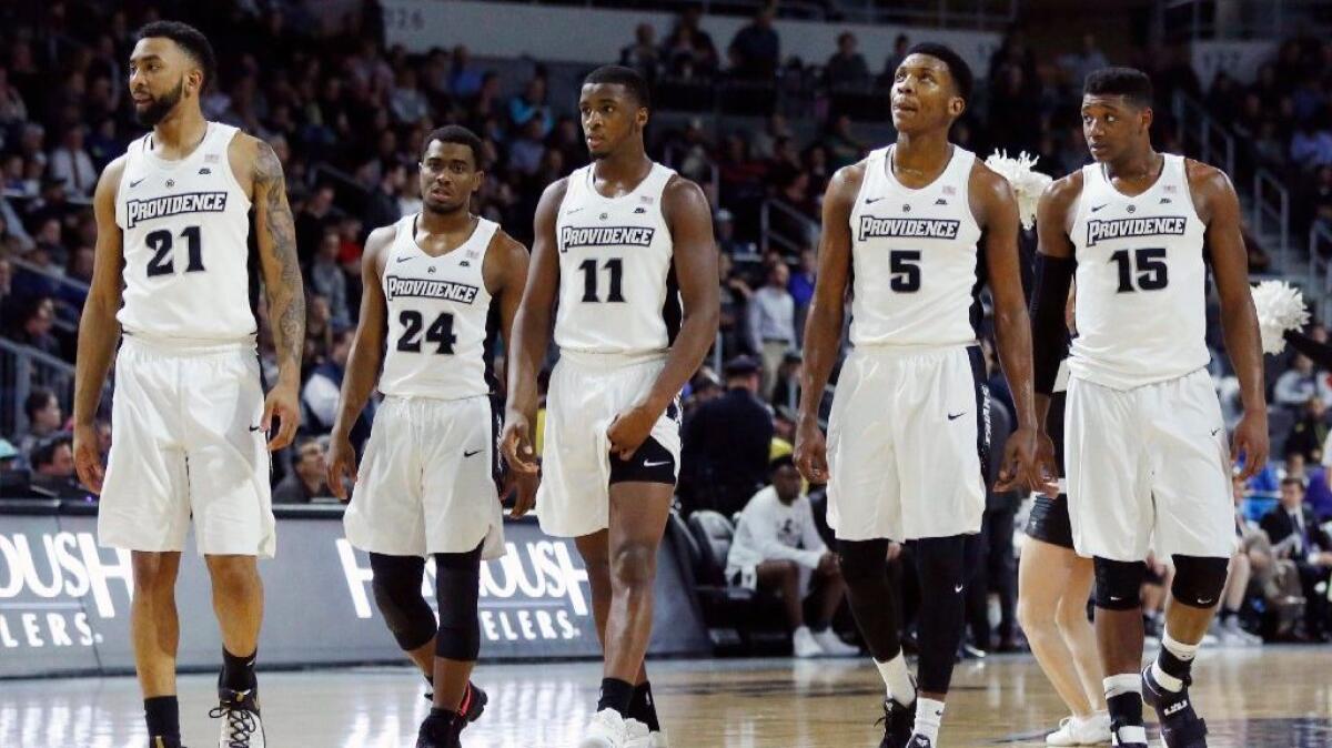 Providence's Jalen Lindsey (21), Kyron Cartwright (24), Alpha Diallo (11), Rodney Bullock (5) and Emmitt Holt (15) on the court during a game against Xavieron Feb. 15