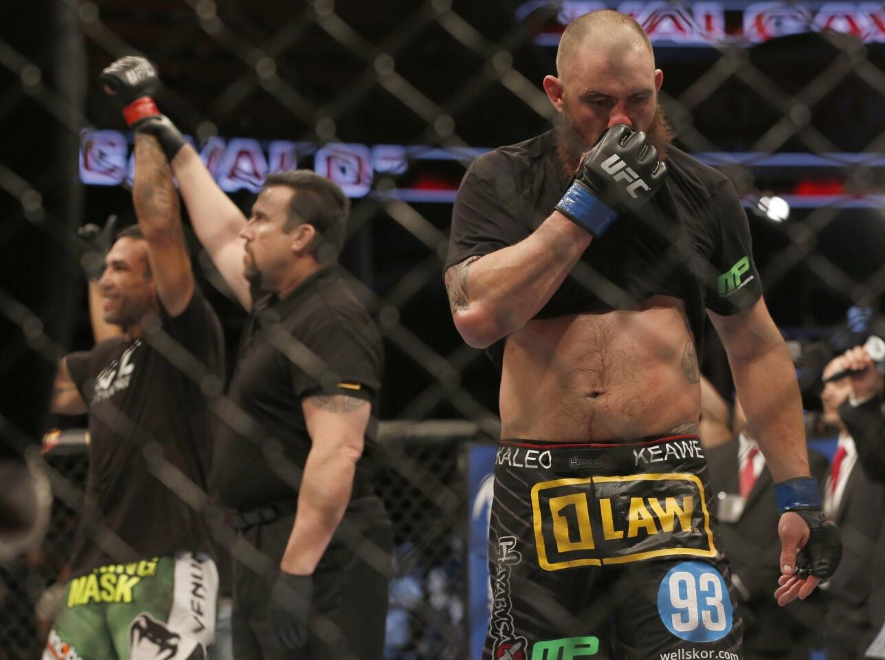 Fabricio Werdum, left, is declared the winner of his UFC heavyweight bout against Travis Browne Saturday night in Orlando.