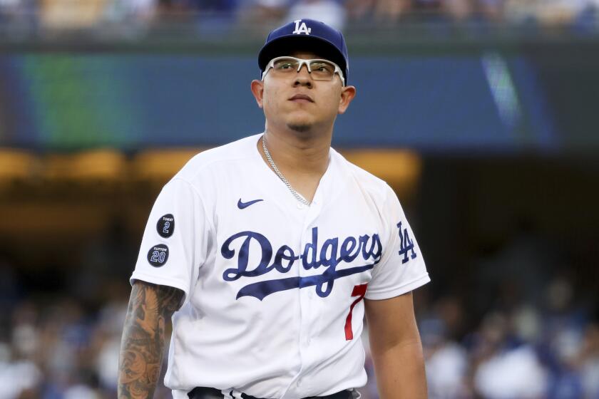 Los Angeles, CA - October 20: Los Angeles Dodgers starting pitcher Julio Urias walks off the field.
