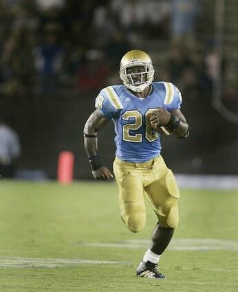 UCLA's Chris Markey runs for extra yardage without a Rice defender in sight.