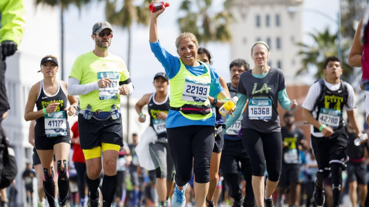 Runners in the L.A. Marathon make their way down Santa Monica Boulevard at the 17th mile.