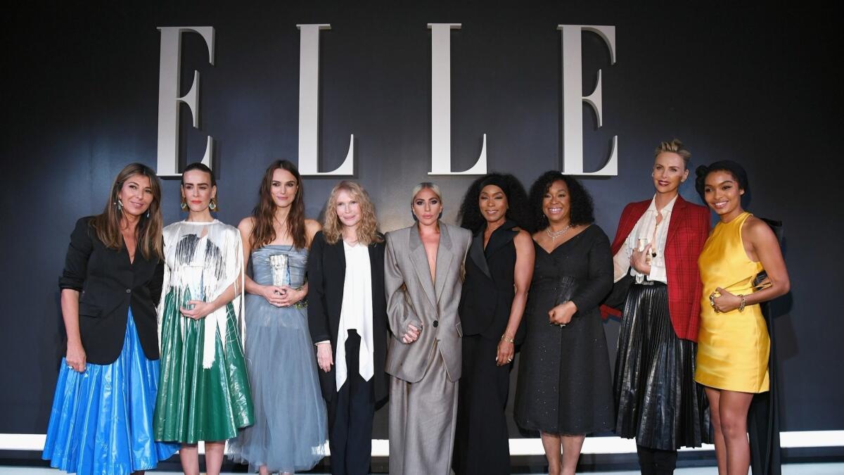 Elle editor-in-chief Nina Garcia from left, Sarah Paulson, Keira Knightley, Mia Farrow, Lady Gaga, Angela Bassett, Shonda Rhimes, Charlize Theron and Yara Shahidi attend Elle's 25th annual Women in Hollywood celebration.