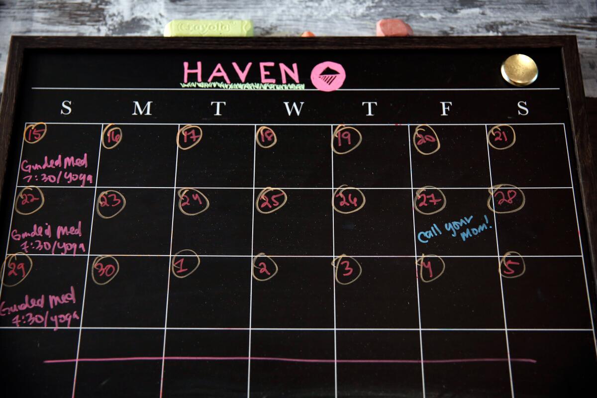 A calendar of events is posted in one of the common areas at the Haven.
