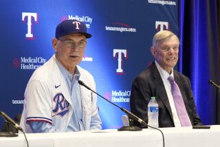 New Texas Rangers baseball team manager Bruce Bochy, left, and Rangers primary owner Ray Davis, respond to questions during a news conference in Arlington, Texas, Monday, Oct. 24, 2022. (AP Photo/Tony Gutierrez)