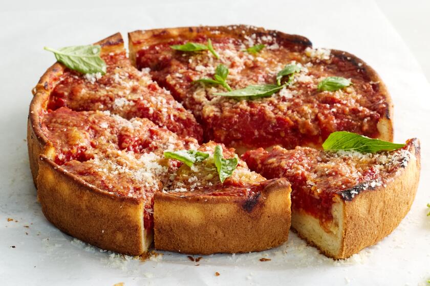 A deep dish pizza, based on the earliest known published recipe.