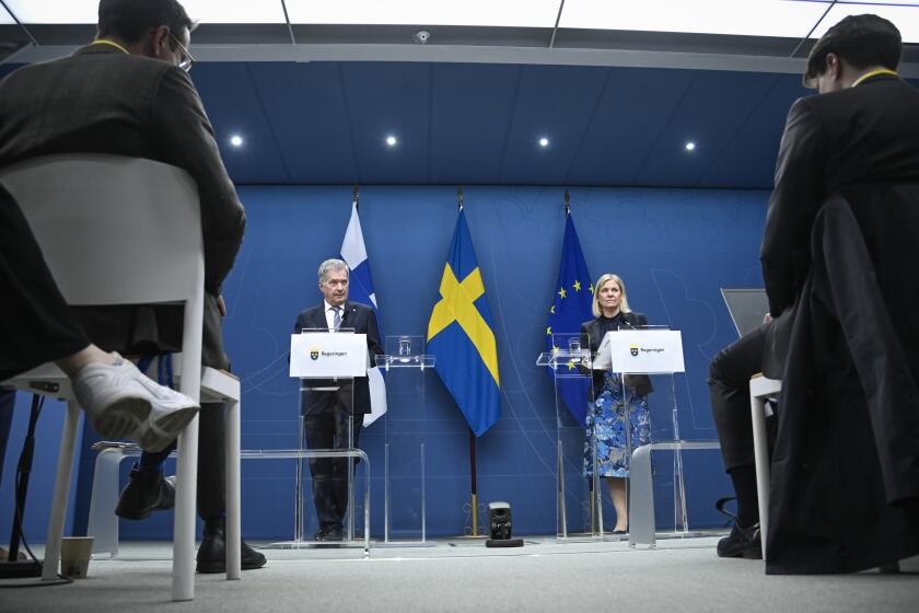 President of Finland Sauli Niinisto, left, and Swedish Prime Minister Magdalena Andersson attend a joint news conference in Stockholm, Tuesday May 17, 2022. (Anders Wiklund/TT News Agency via AP)