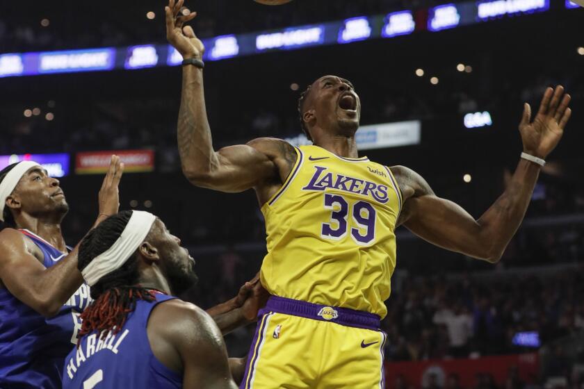 LOS ANGELES, CA, TUESDAY, OCTOBER 22, 2019 - Los Angeles Lakers center Dwight Howard (39) scores on a rebound one LA Clippers forward Montrezl Harrell (5) during second half action at Staples Center. (Robert Gauthier/Los Angeles Times)
