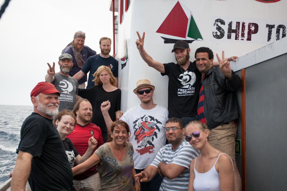 A photo shows crew members and passengers aboard the Marianne of Gothenburg, which was intercepted by Israeli forces on June 29.