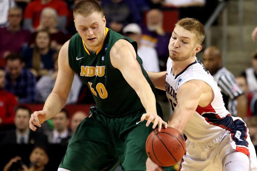 Gonzaga forward Domantas Sabonis tries to steal the ball from North Dakota State forward Dexter Werner in the second half of the Bulldogs' 86-76 victory on Friday night.