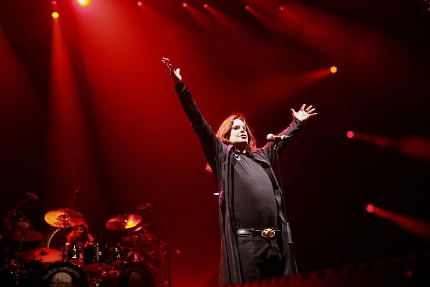 LOS ANGELES, CA-SEPTEMBER 3, 2013: Heavy metal stalwarts Black Sabbath rocked the Los Angeles Sports Arena on Tuesday night. Ozzy Osbourne reprised his role as the band's lead singer. (Michael Robinson Chavez/Los Angeles Times)