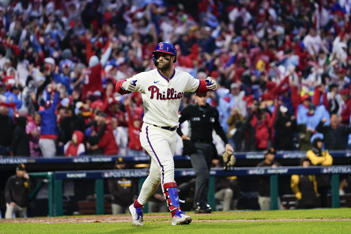 Phillies' Bryce Harper rounds the bases after a two-run home run during the eighth inning in Game 5 of the NLCS.