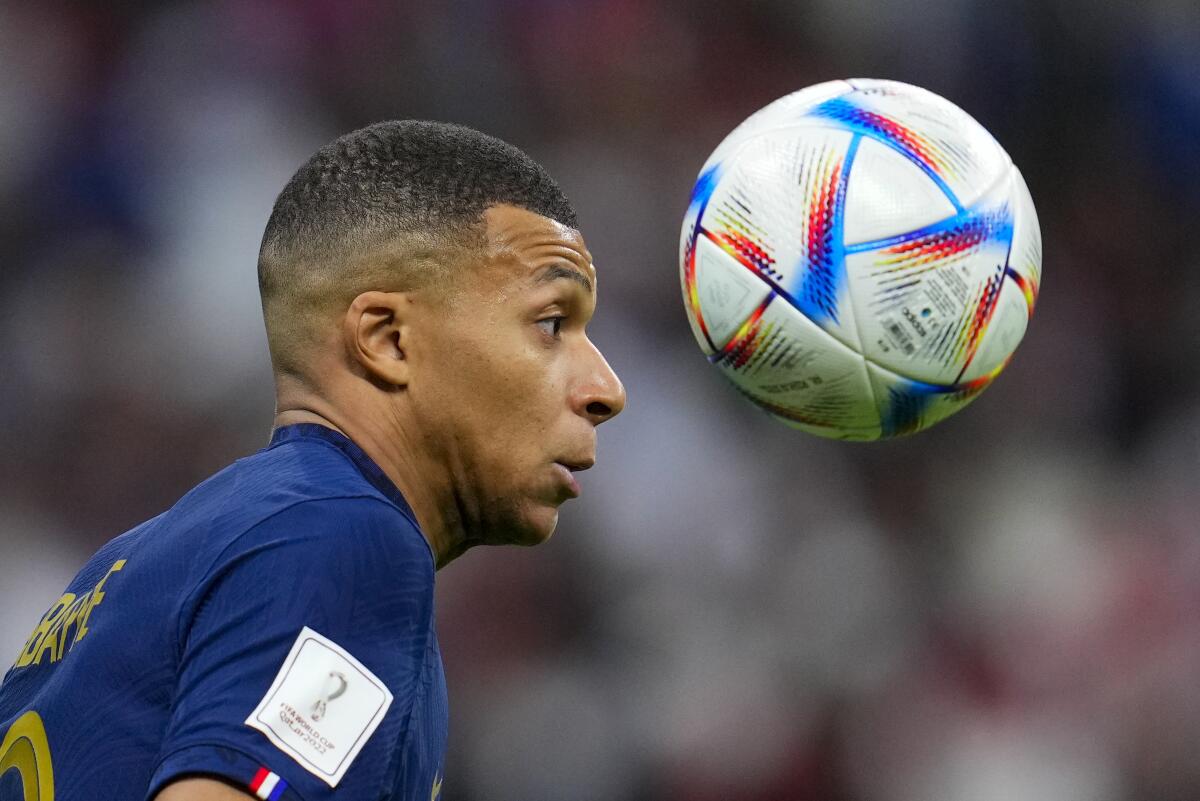 France's Kylian Mbappe attempts to control the ball during t 