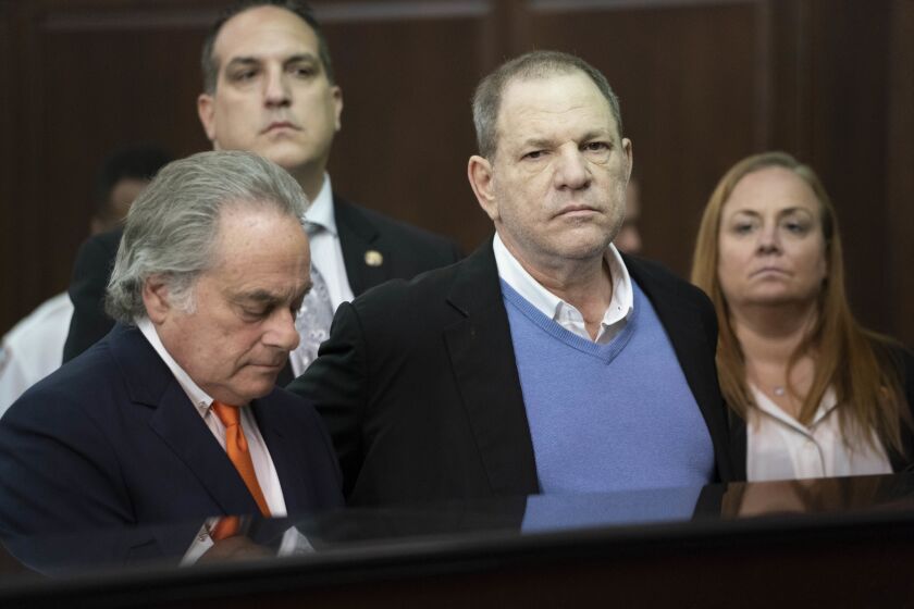 Harvey Weinstein, center, appears with his attorney Benjamin Brafman before a judge Friday morning in Manhattan, where he was charged with rape and other sex crimes.