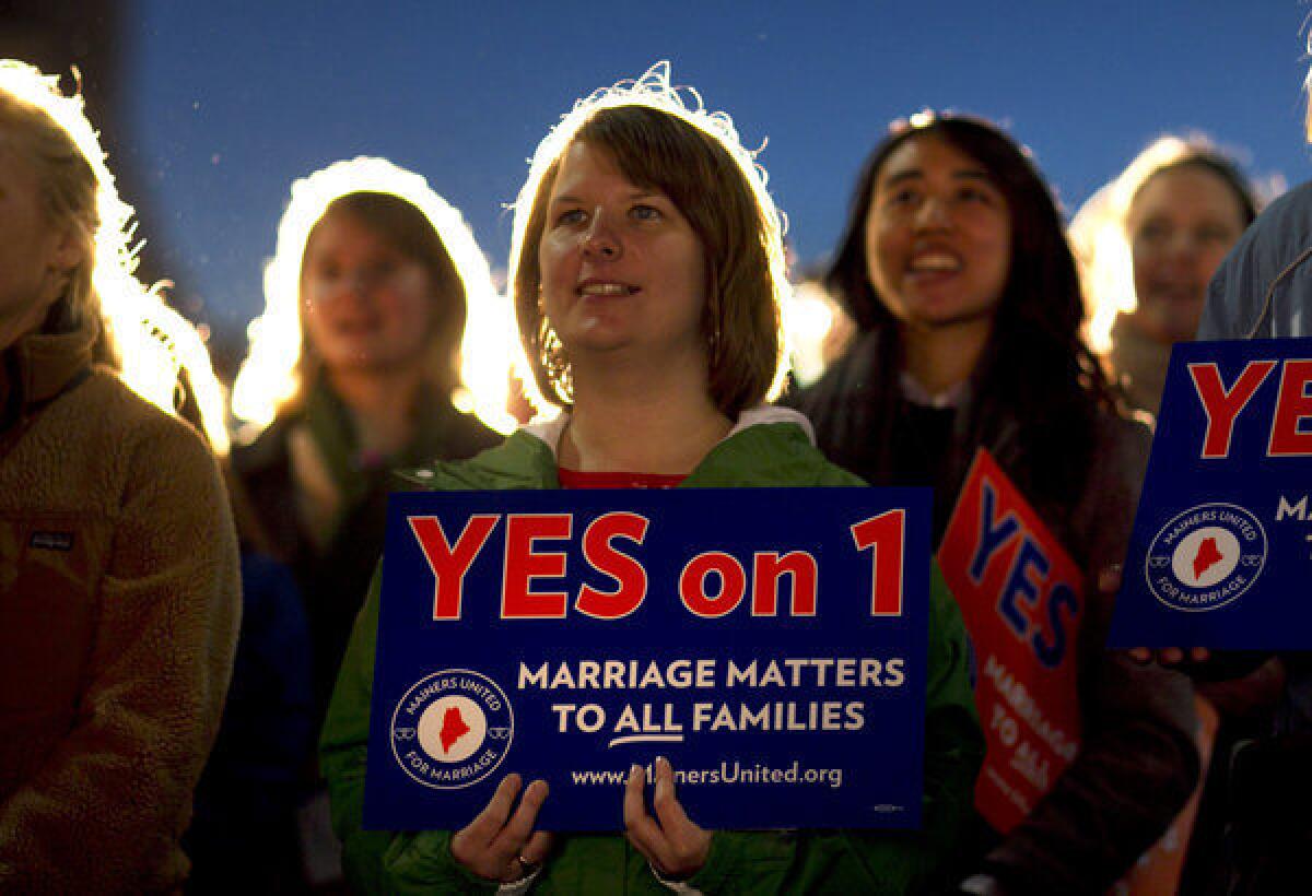 Ashley Gorczyga attends a rally in support of gay marriage in downtown Portland, Maine.