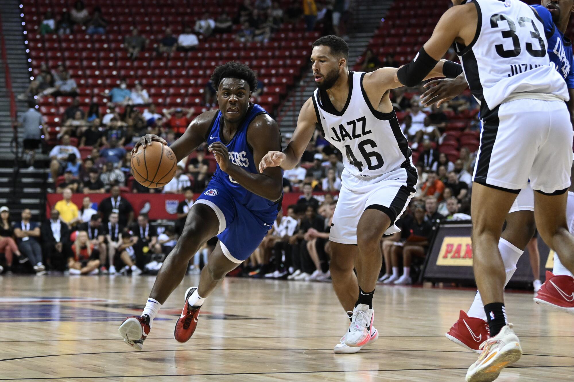 Clippers forward Kobe Brown drives past Utah's Keshawn Justice during an NBA Summer League game.
