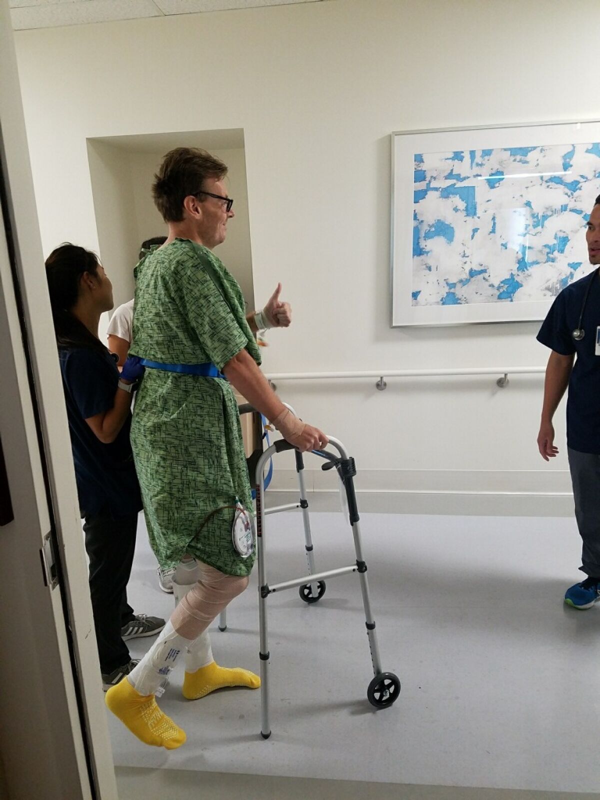 Colin Jackson uses a walker after his 2019 surgery to rebuild his hip and leg following a bone cancer battle.