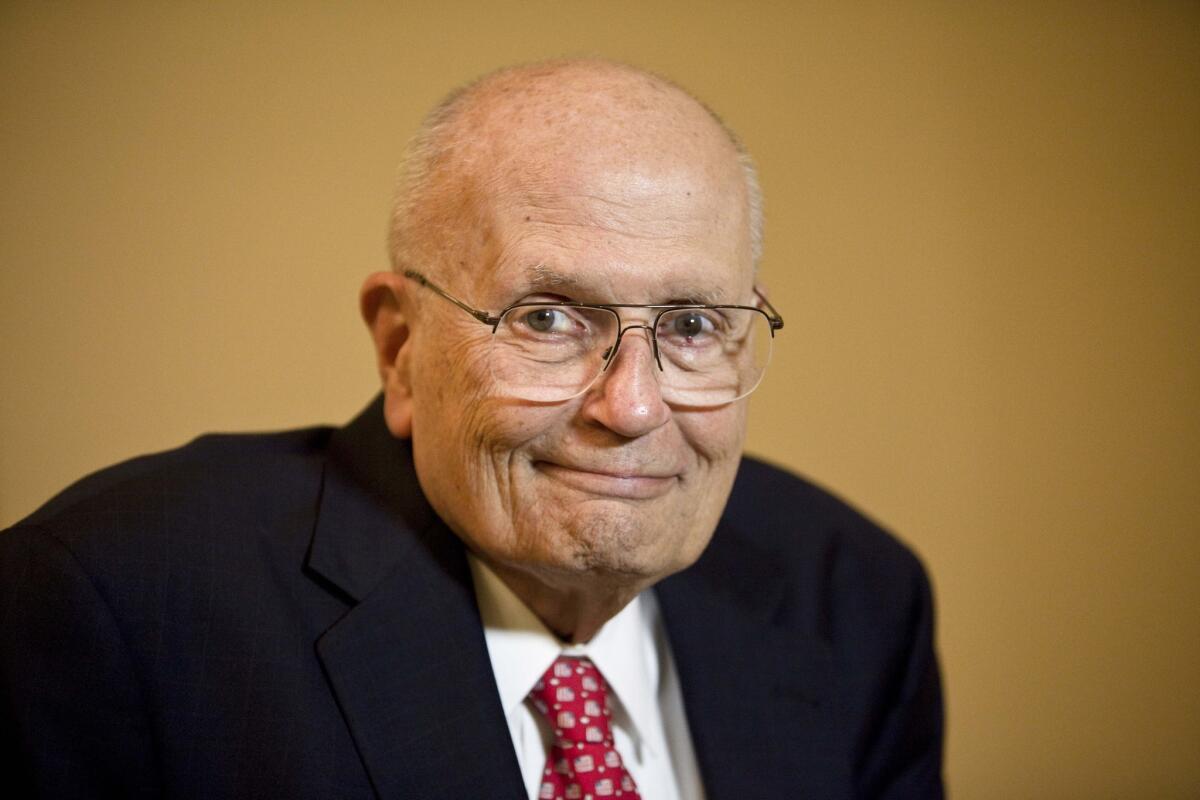 Rep. John D. Dingell (D-Mich.) prepares for an interview in Washington on Nov. 7, 2009.