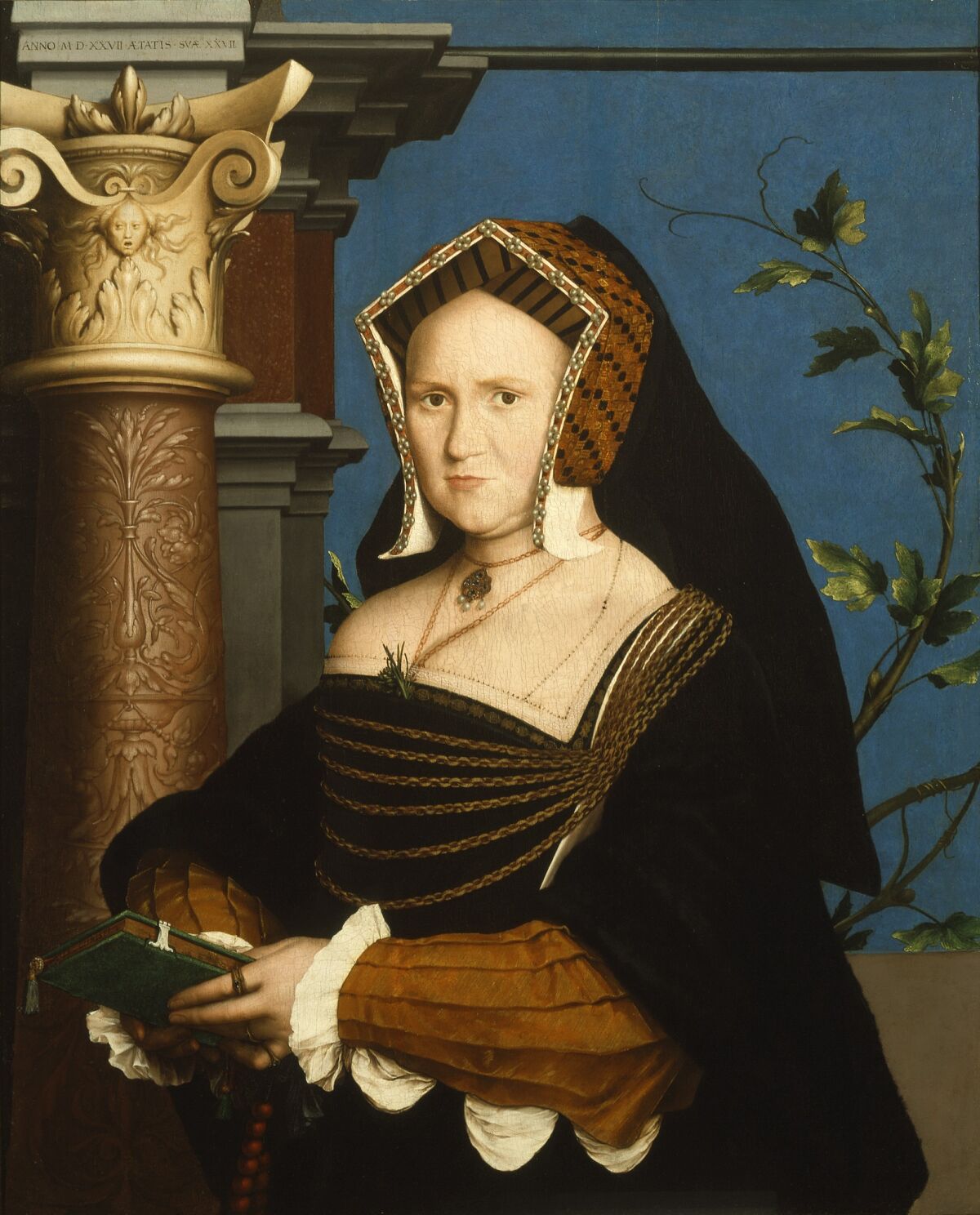 A painting of a woman wearing an elaborate headdress and gown, holding a book. 