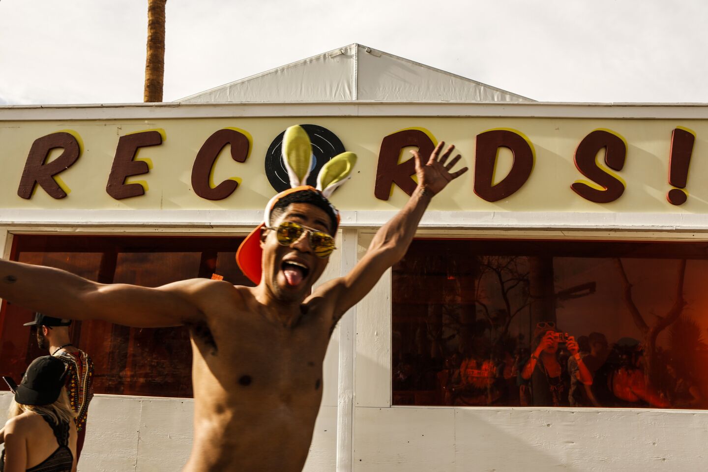 A festivalgoer poses at Coachella's record store on Saturday, which was also Record Store Day.