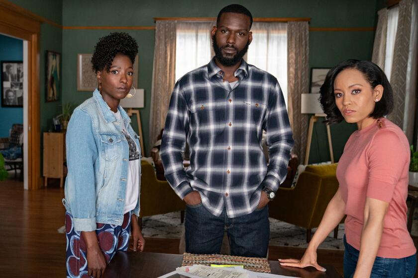 Rutina Wesley, left, Kofi Siriboe and Dawn-Lyen Gardner in "Queen Sugar" on OWN.