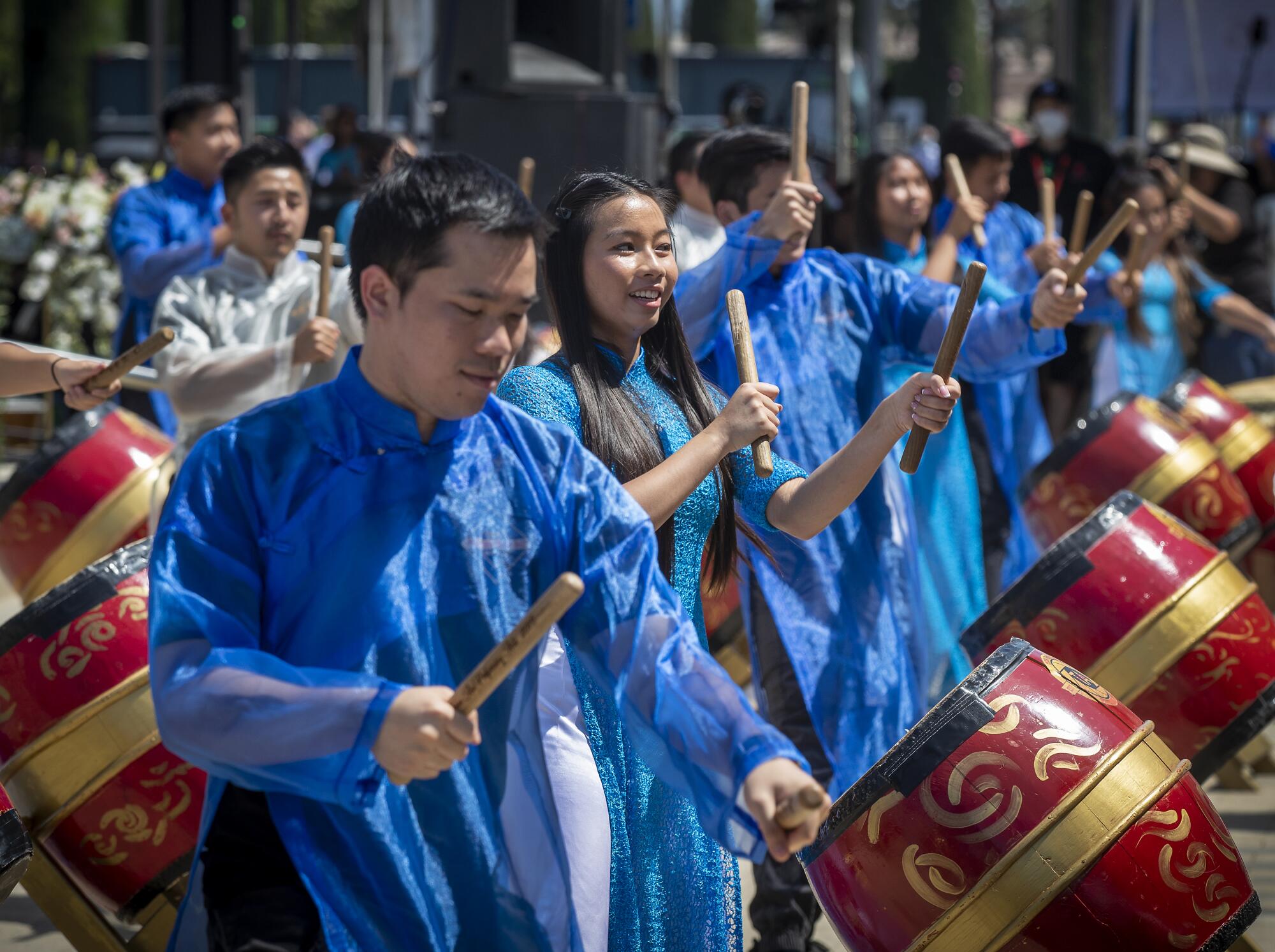Drummers perform during a musical prelude and colorful procession.