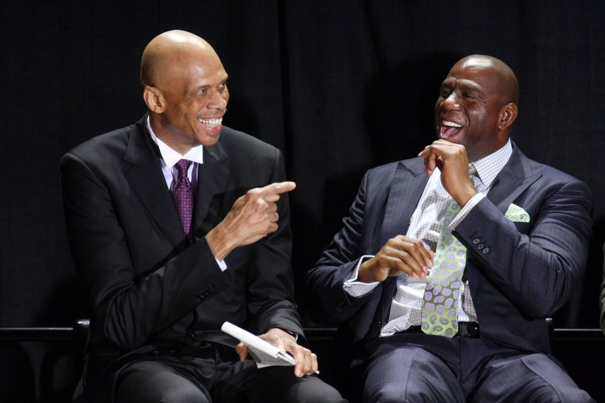 Kareem Abdul-Jabbar, left, and Earvin "Magic" Johnson attend the Kareem Abdul-Jabbar Statue Unveiling at Staples Center.