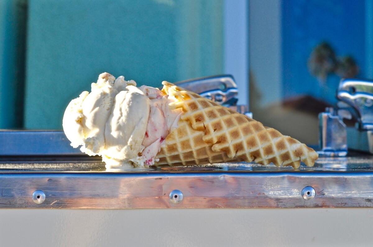 A waffle cone of Earl Grey and strawberry buttermilk ice cream on Carmela Ice Cream Co.'s old ice cream cart outside the Pasadena shop.