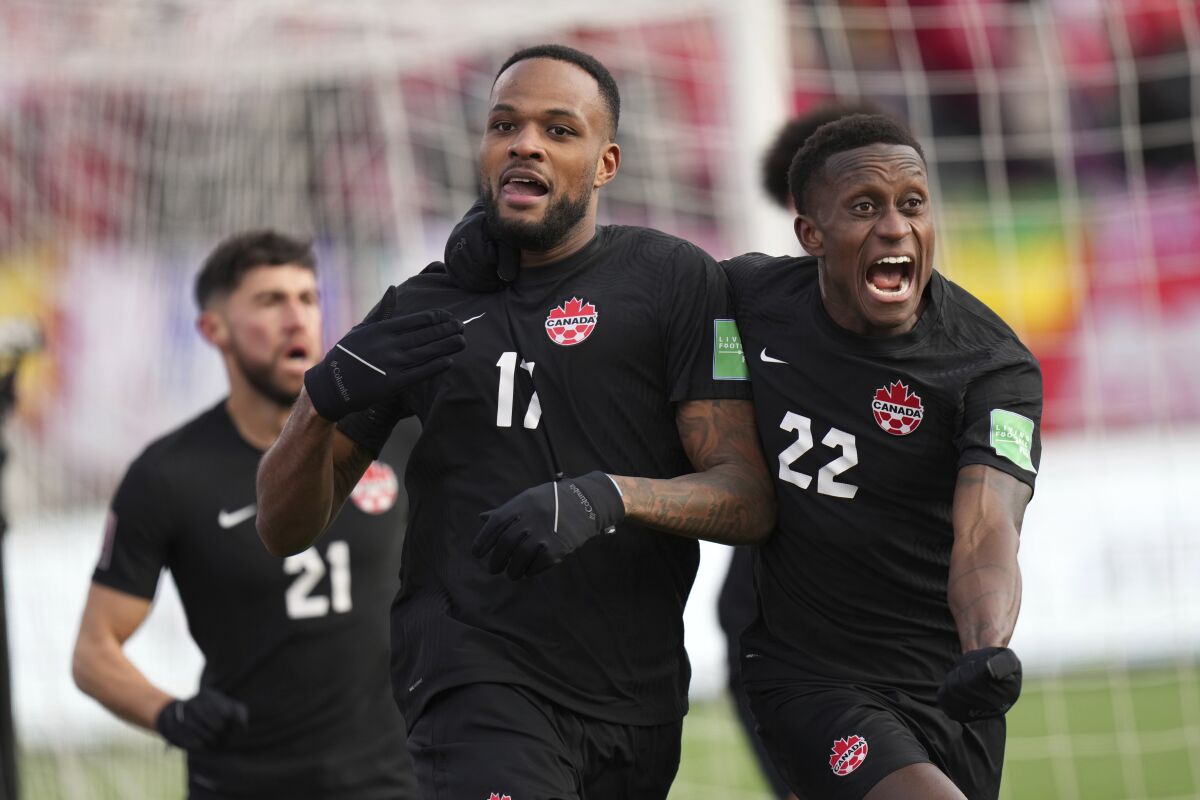 Canada's Cyle Larin celebrates after scoring a goal against the U.S. during a World Cup qualifier