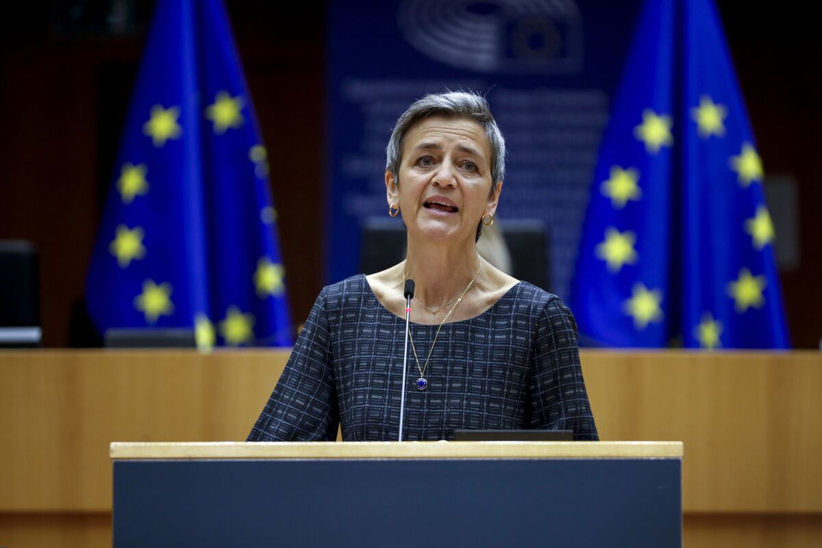 FILE - European Commissioner Margrethe Vestager addresses European lawmakers at the European Parliament in Brussels, on May 18, 2021. The European Union on Thursday blocked the merger between South Korean shipbuilders Hyundai and Daewoo, saying a union between two of the world’s biggest players in the industry would have given the combined company a global stranglehold on the production of liquified natural gas carriers. EU Competition Commissioner Margrethe Vestager says the merger would have led to “fewer suppliers and higher prices for large vessels transporting LNG.” European customers account for almost half the orders in the $45 billion market. (AP Photo/Francisco Seco, File