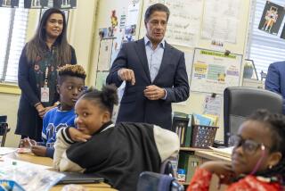 Carson, CA - December 18: Los Angeles Unified Superintendent Alberto M. Carvalho talks with student as he visits a Winter Academy program classroom at Carson Street Elementary School on Monday, Dec. 18, 2023 in Carson, CA. (Brian van der Brug / Los Angeles Times)