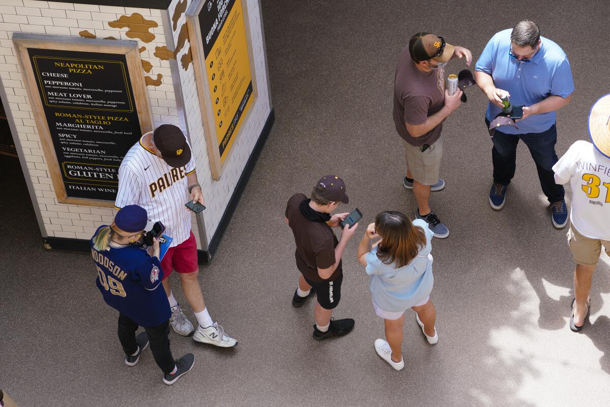 Fans at Petco Park try to order concessions off phone app during 2021 Padres opener.