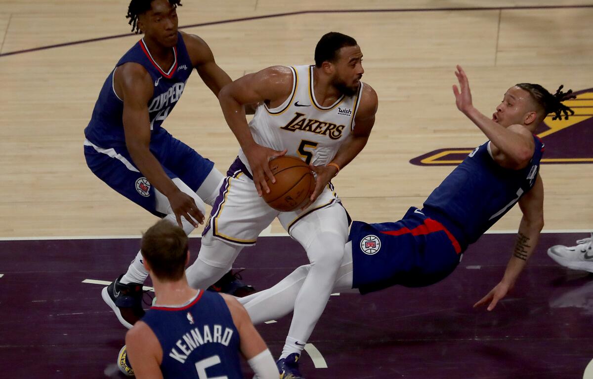 Lakers guard Talen Horton-Tucker powers to the basket during a 131-106 preseason win.