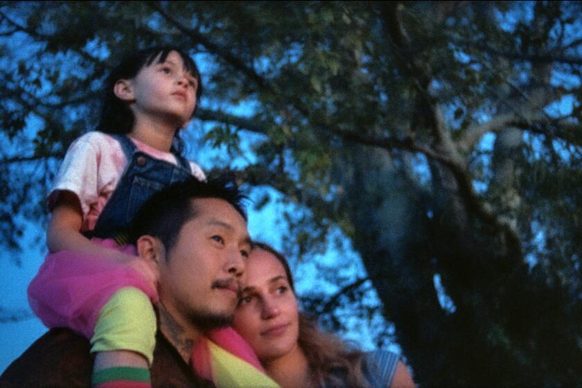 (L to R) Sydney Kowalske as "Jessie", Justin Chon as "Antonio" and Alicia Vikander as "Kathy" in BLUE BAYOU, a Focus Features release. Credit : Focus Features