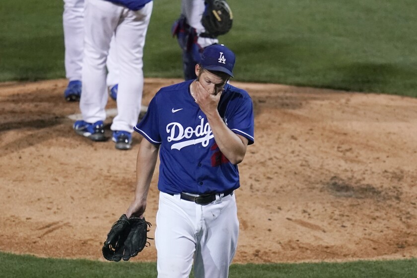 Dodgers pitcher Clayton Kershaw leaves in the fourth inning against Oakland.