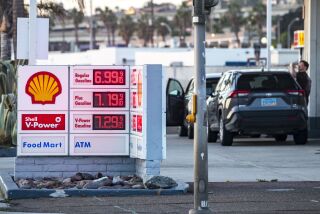 San Diego, CA - September 27: People stand near the pumps at Shell Gas Station on Tuesday, Sept. 27, 2022 in San Diego, CA. The average price for a gallon of regular in the area increased nearly 12 cents Tuesday, reaching $5.90. That's 48.5 cents a gallon higher than one week ago and 65 cents higher than one month ago. (Meg McLaughlin / The San Diego Union-Tribune)