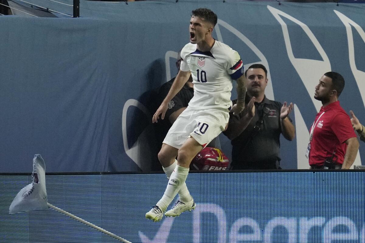 United States' Christian Pulisic celebrates after scoring against Mexico.