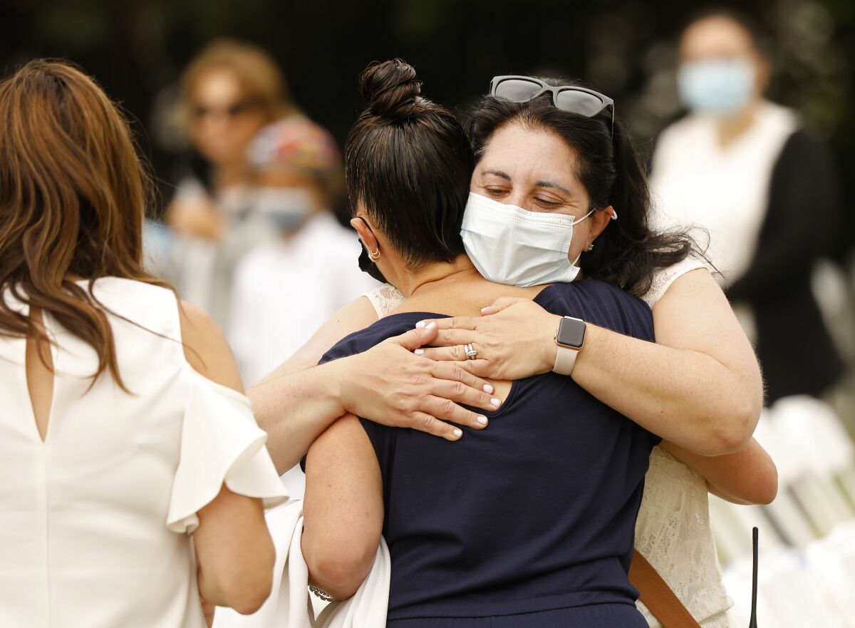 Women hug before a Yom Kippur service.