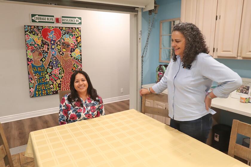 Co-directors Nancy Galeana and Isabel Kluwe chat in the Waymakers Youth Shelter.