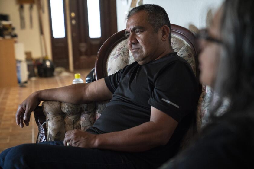 Former U.S. Customs and Border Protection agent Raul Rodriguez, 51 and his wife Anita Rodriguez, 54, Immigration Services officer, talk about their experience in their home after the government found out that Mr. Rodriguez’s U.S. brith certificate was illegitimate as he was born in Mexico on Friday, Nov. 22, 2019 in San Benito, Tex. He says that he was not aware of it until the government investigated him early this year as he was trying to get legal residency for his brother. Verónica G. Cárdenas / For The Times