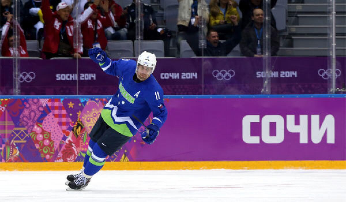 Slovenia's Anze Kopitar celebrates after scoring a goal in the first period against Austria at the Bolshoy Ice Dome on Tuesday. Slovenia has advanced to the quarterfinals.