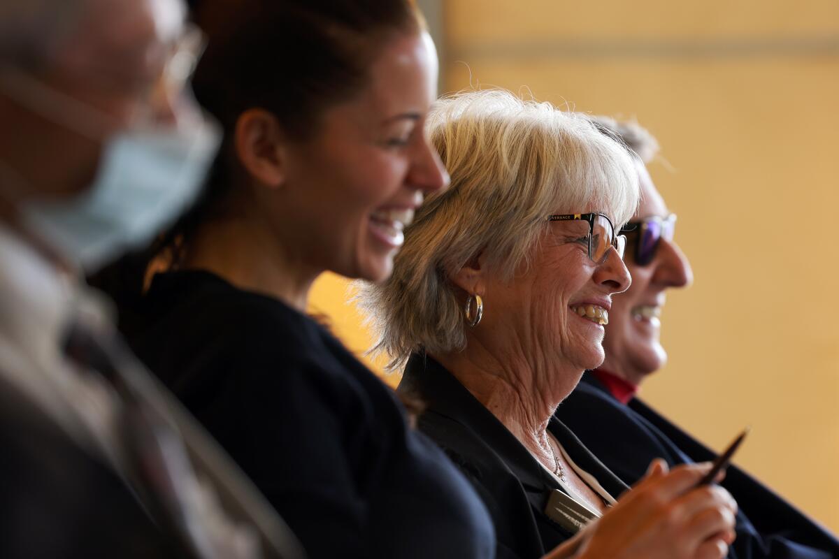 Mirandi Babitz, second right, laughs with friends and family during an intimate memorial for sister and author Eve Babitz.
