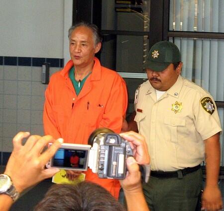 Kazuyoshi Miura is escorted from court, June 6, 2008, after his bail hearing in Saipan.